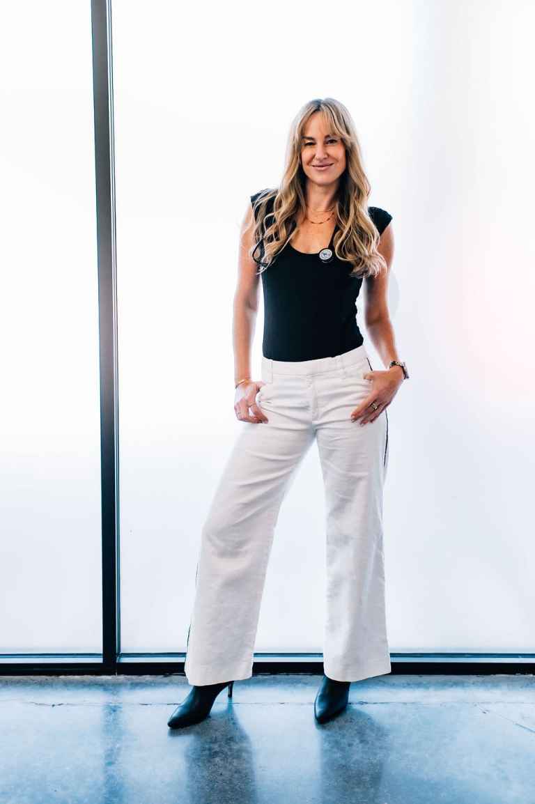 Dr. Ann Bosiack, veterinary ophthalmologist, standing confidently in a professional setting, showcasing her dedication to animal eye care at Veterinary Vision Specialists.